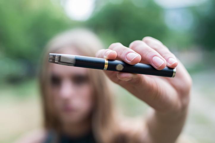 Girl holding a vape pen